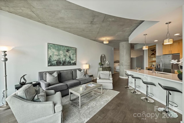 living area with dark wood-style floors and baseboards