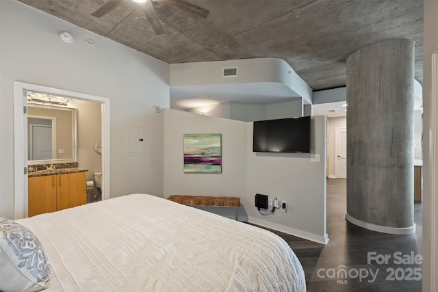 bedroom with dark wood finished floors, a sink, ceiling fan, connected bathroom, and baseboards