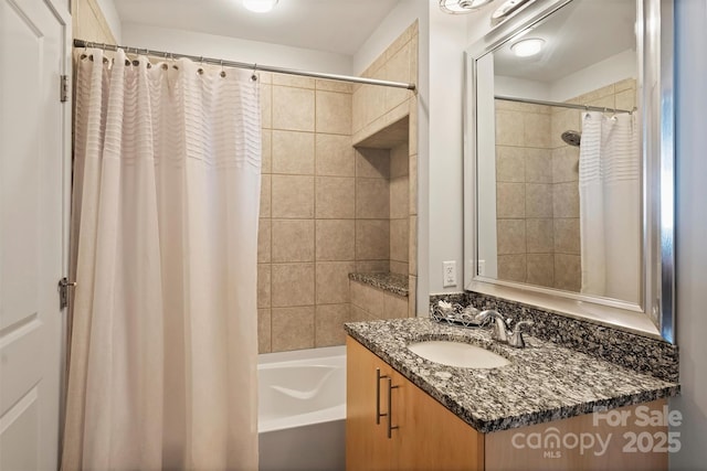 bathroom with shower / bathtub combination with curtain and vanity