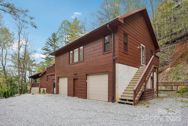 909 Niley Cook Rd, Blowing Rock, NC 28605 - view of side of property featuring driveway, a garage, and stairs