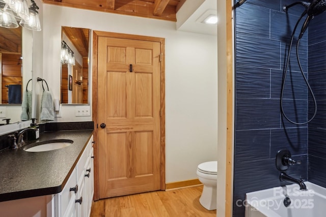909 Niley Cook Rd, Blowing Rock, NC 28605 - bathroom featuring toilet, bathing tub / shower combination, wood finished floors, and vanity