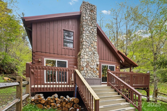 909 Niley Cook Rd, Blowing Rock, NC 28605 - rear view of house featuring stairs, board and batten siding, a wooden deck, and a chimney