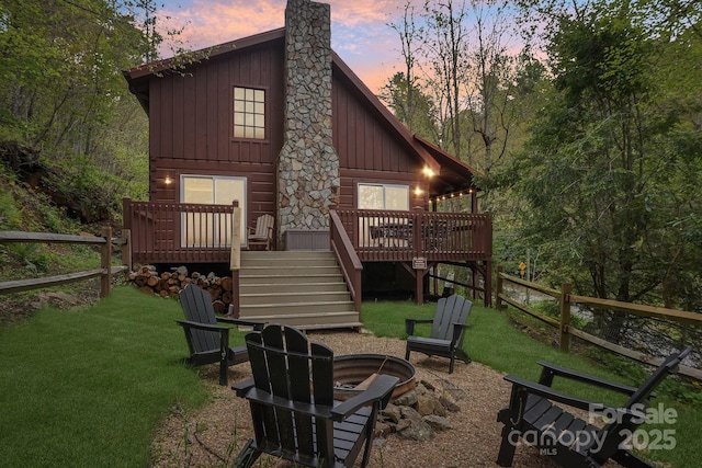 909 Niley Cook Rd, Blowing Rock, NC 28605 - back of property featuring stairs, a wooden deck, a fire pit, and fence