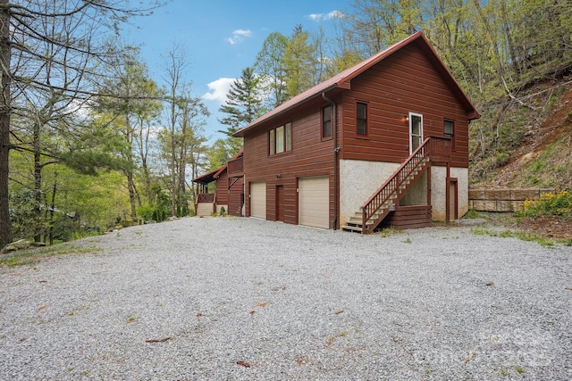 909 Niley Cook Rd, Blowing Rock, NC 28605 - view of property exterior featuring gravel driveway and stairway
