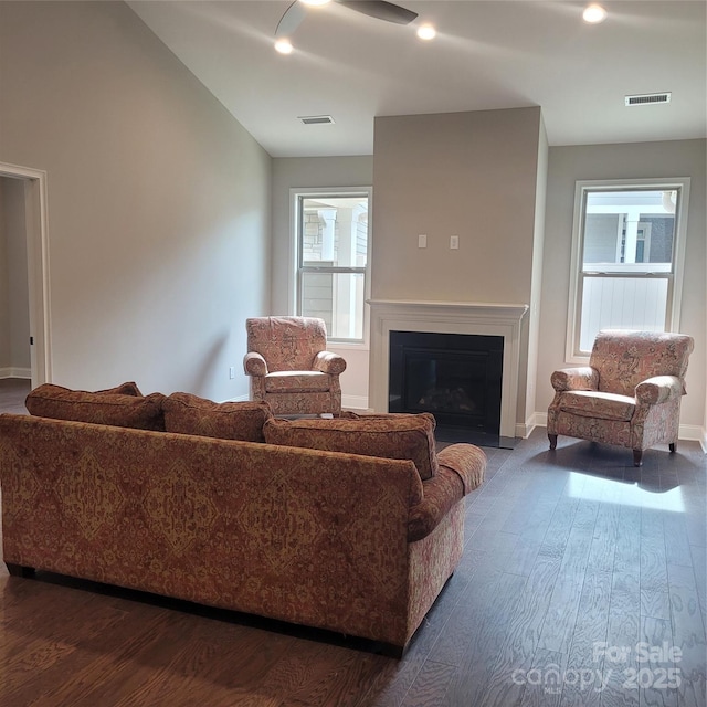 835A Wynnshire Dr Unit 53, Hickory, NC 28601 - living room with a ceiling fan, baseboards, a glass covered fireplace, visible vents, and dark wood-type flooring