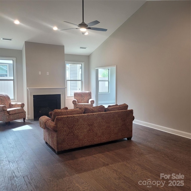 835A Wynnshire Dr Unit 53, Hickory, NC 28601 - living room with visible vents, lofted ceiling, a fireplace with flush hearth, and dark wood-style floors