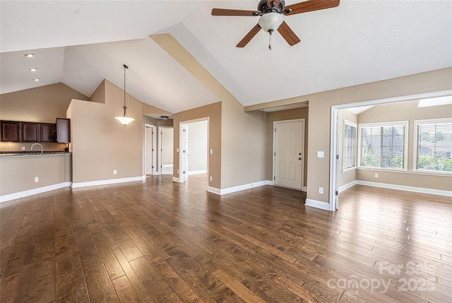 33 Braeburn Way, Flat Rock, NC 28731 - unfurnished living room with a ceiling fan, a sink, baseboards, lofted ceiling, and dark wood-style floors