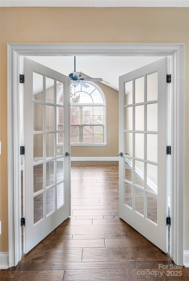 33 Braeburn Way, Flat Rock, NC 28731 - doorway to outside featuring wood finished floors, vaulted ceiling, baseboards, and ceiling fan