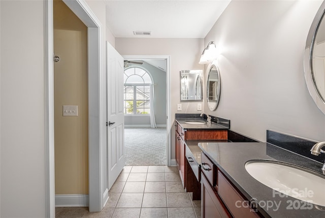 33 Braeburn Way, Flat Rock, NC 28731 - full bath with visible vents, baseboards, two vanities, and a sink