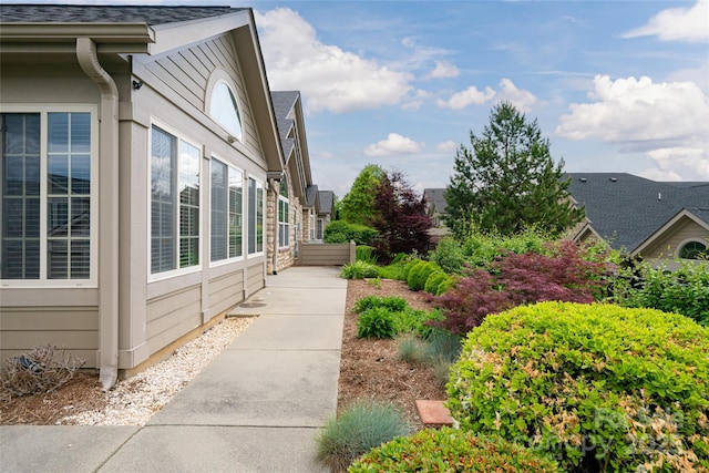33 Braeburn Way, Flat Rock, NC 28731 - view of side of home featuring roof with shingles