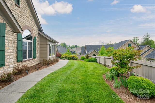 33 Braeburn Way, Flat Rock, NC 28731 - view of yard with a residential view and fence