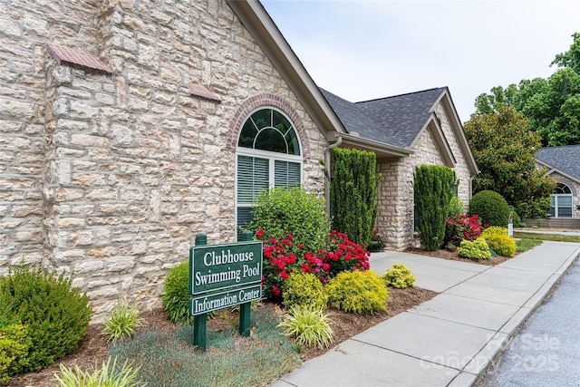 33 Braeburn Way, Flat Rock, NC 28731 - view of property exterior featuring stone siding and roof with shingles