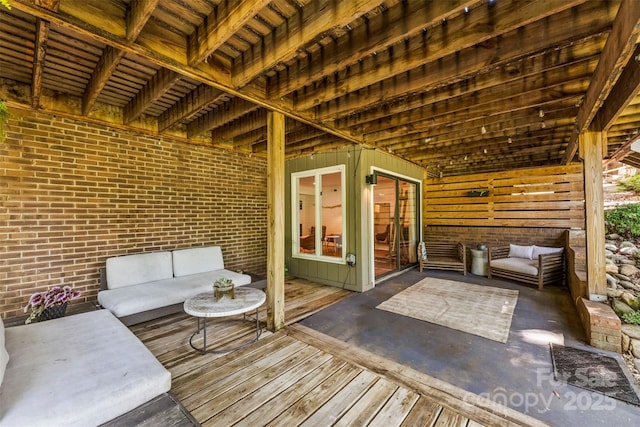 wooden deck featuring an outdoor hangout area