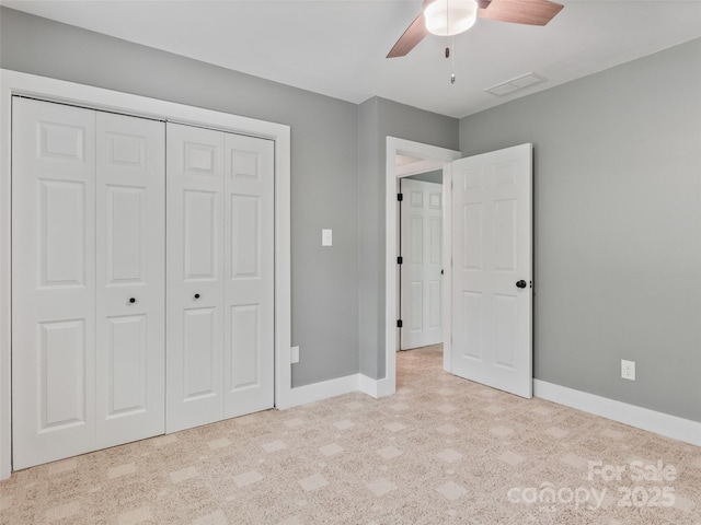unfurnished bedroom featuring baseboards, a closet, and a ceiling fan