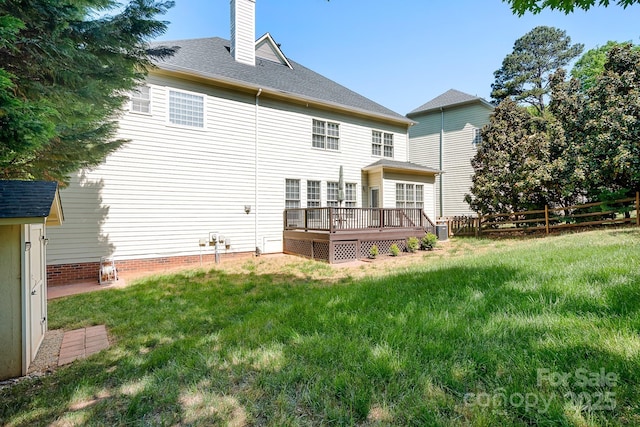 16028 Hallaton Dr, Huntersville, NC 28078 - rear view of property featuring a yard, a chimney, a wooden deck, and fence