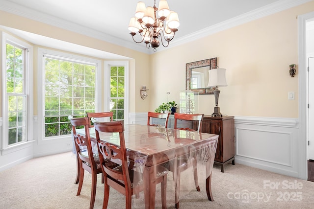 16028 Hallaton Dr, Huntersville, NC 28078 - dining room with ornamental molding, light carpet, an inviting chandelier, and wainscoting