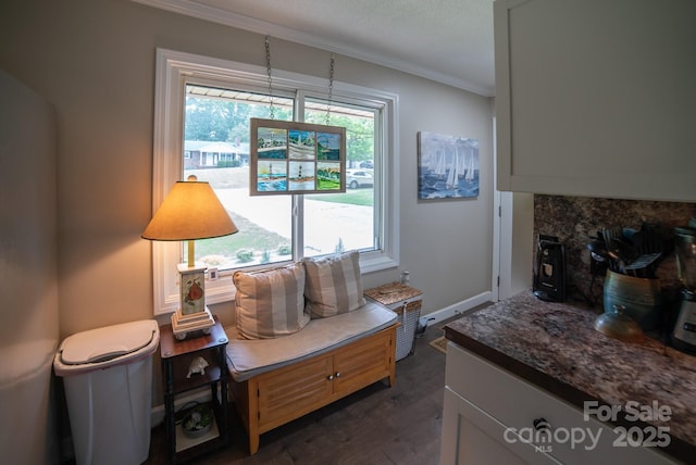 interior space featuring crown molding and dark wood-type flooring