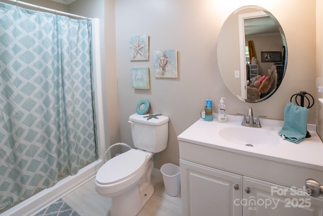 full bath featuring toilet, vanity, and a shower with shower curtain