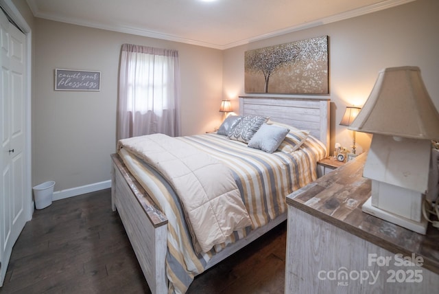 bedroom featuring baseboards, dark wood-style flooring, and ornamental molding