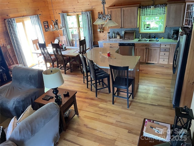 96 Trails End Ln, Maggie Valley, NC 28751 - dining room with light wood-type flooring and wooden walls