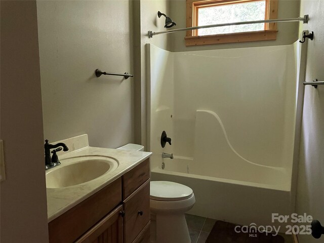 96 Trails End Ln, Maggie Valley, NC 28751 - full bath featuring tile patterned flooring, toilet, vanity, and tub / shower combination
