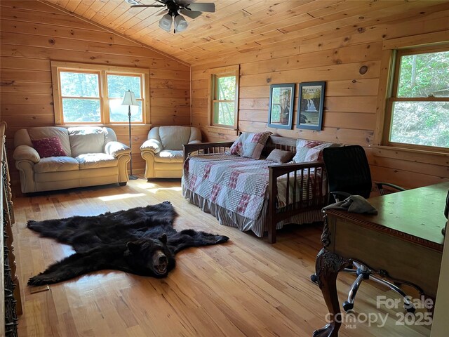 96 Trails End Ln, Maggie Valley, NC 28751 - bedroom featuring vaulted ceiling, wood finished floors, wood walls, and wood ceiling