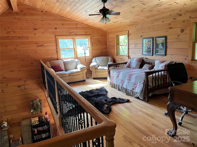 96 Trails End Ln, Maggie Valley, NC 28751 - bedroom featuring vaulted ceiling, wood walls, wood finished floors, wooden ceiling, and ceiling fan