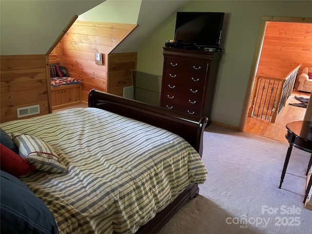 96 Trails End Ln, Maggie Valley, NC 28751 - carpeted bedroom with lofted ceiling, wooden walls, and baseboards