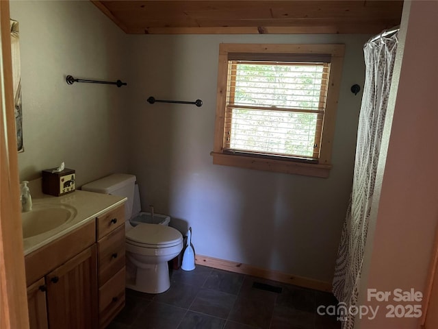 96 Trails End Ln, Maggie Valley, NC 28751 - bathroom featuring toilet, vanity, tile patterned floors, a shower with curtain, and baseboards