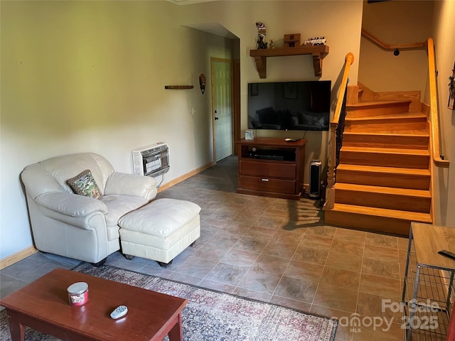 96 Trails End Ln, Maggie Valley, NC 28751 - living area with heating unit, stairs, and baseboards