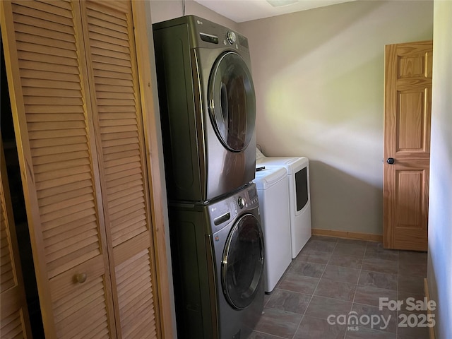 96 Trails End Ln, Maggie Valley, NC 28751 - laundry room with stacked washer / dryer and baseboards
