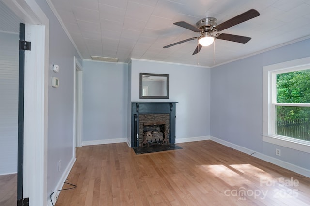 917 Laye St, Belmont, NC 28012 - unfurnished living room with wood finished floors, ornamental molding, a fireplace, a ceiling fan, and baseboards