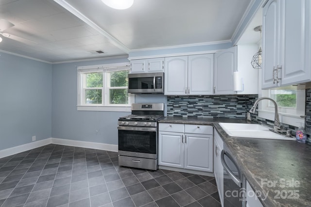917 Laye St, Belmont, NC 28012 - kitchen with appliances with stainless steel finishes, a sink, dark tile patterned flooring, backsplash, and ceiling fan