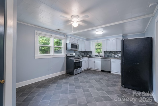 917 Laye St, Belmont, NC 28012 - kitchen with appliances with stainless steel finishes, a sink, crown molding, ceiling fan, and backsplash