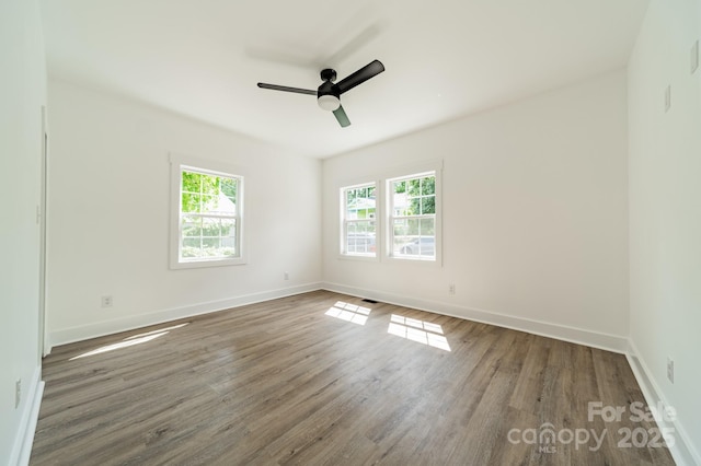 322 S Hill St, Gastonia, NC 28052 - spare room with plenty of natural light, baseboards, wood finished floors, and a ceiling fan