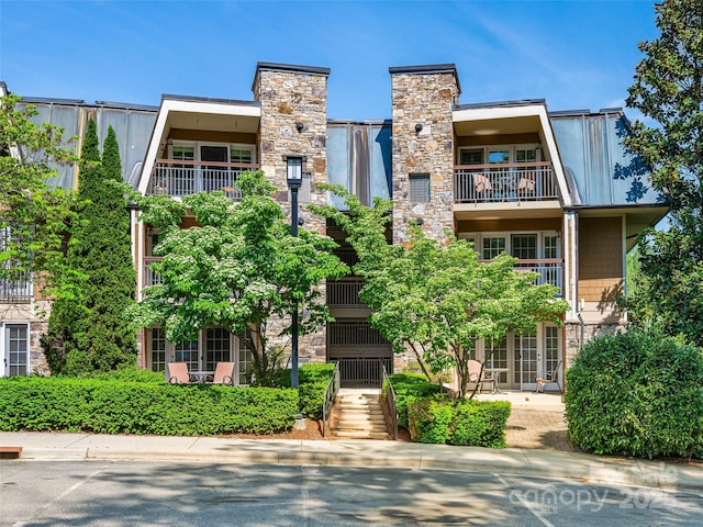 view of property featuring stairway