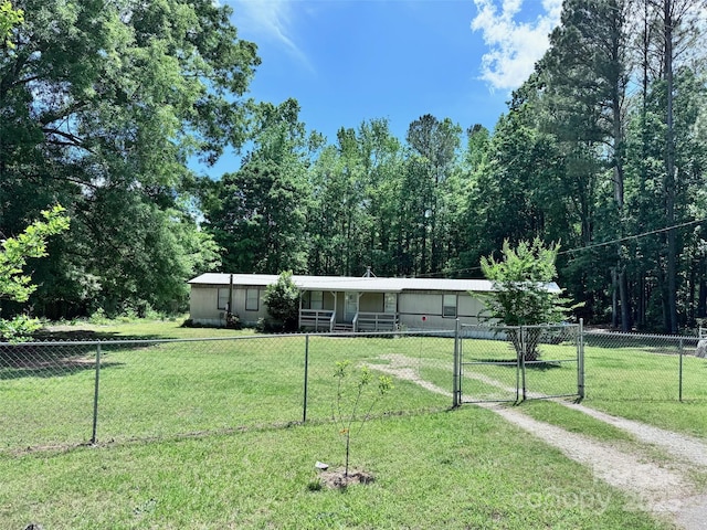 view of front of house with a gate, a front lawn, and a fenced front yard
