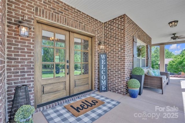3440 17th Ave NE, Hickory, NC 28601 - property entrance featuring covered porch, brick siding, french doors, and ceiling fan