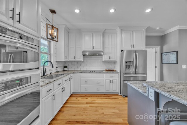 3440 17th Ave NE, Hickory, NC 28601 - kitchen with a sink, white cabinetry, crown molding, light wood-style floors, and appliances with stainless steel finishes