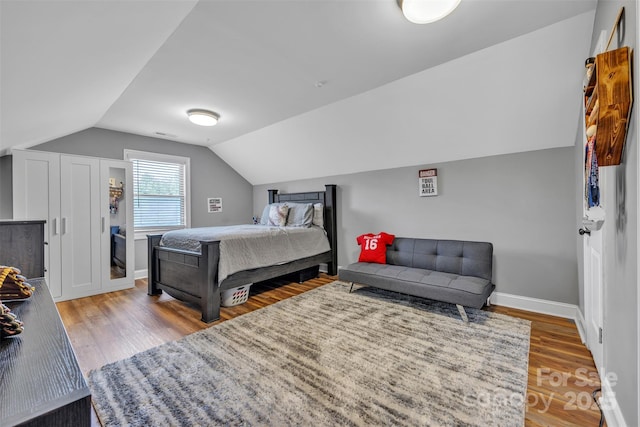 3440 17th Ave NE, Hickory, NC 28601 - bedroom with vaulted ceiling, baseboards, and wood finished floors