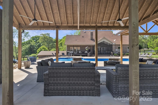 3440 17th Ave NE, Hickory, NC 28601 - view of patio with outdoor lounge area, a ceiling fan, and a fenced in pool