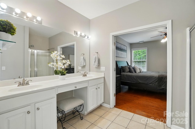 14402 Asheton Creek Dr, Charlotte, NC 28273 - ensuite bathroom featuring tile patterned floors, a shower stall, double vanity, and ceiling fan