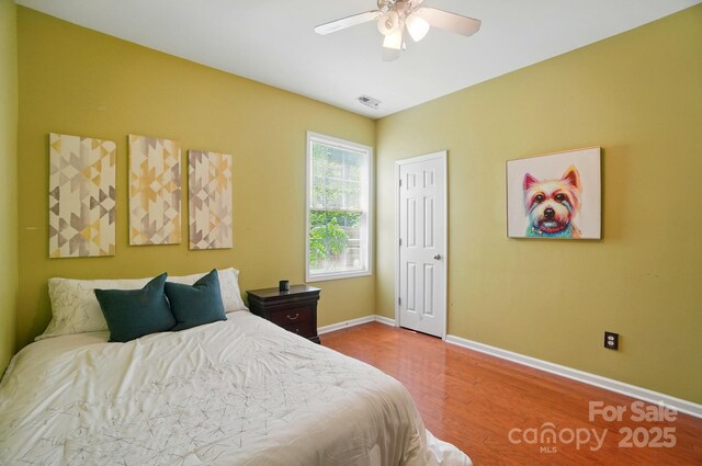 14402 Asheton Creek Dr, Charlotte, NC 28273 - bedroom featuring wood finished floors, baseboards, and a ceiling fan