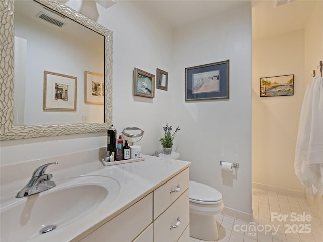 full bath with toilet, vanity, visible vents, tile patterned floors, and baseboards