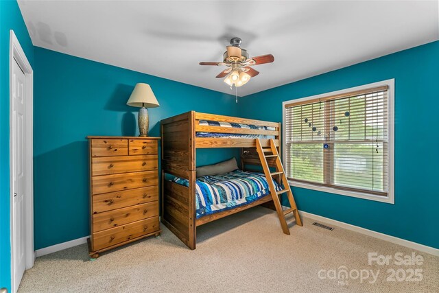 bedroom featuring carpet, baseboards, and ceiling fan