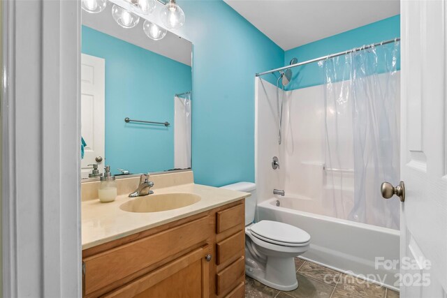 full bath with toilet, vanity, shower / bath combo, and tile patterned floors