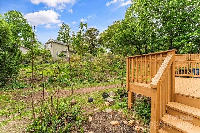 view of yard with a wooden deck