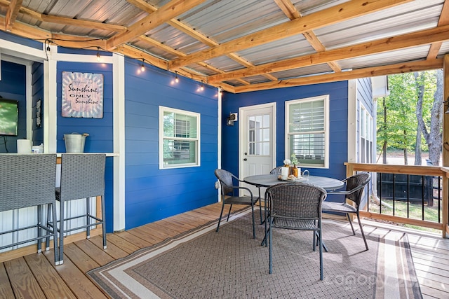 wooden terrace featuring outdoor dining space