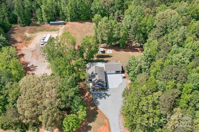 aerial overview of property's location with a forest
