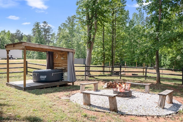 view of yard with an outdoor fire pit